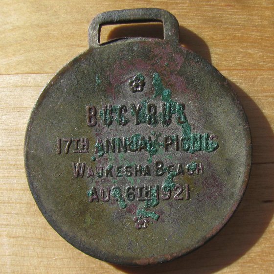 An-Old-And-Dated-Watch-Fob-In-The-Woods